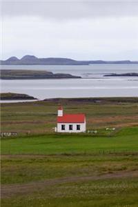 A Solitary Rustic White Church by the Sea in Iceland Journal