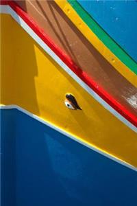 A Close-Up Side View of a Colorful Boat in Malta Journal