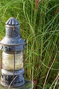 An Old Lantern in the Grass Journal