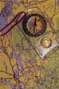Compass on an Old Map Journal