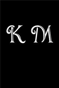 K M