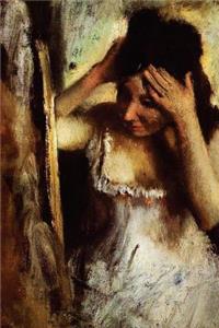 ''Woman Combing Her Hair in Front of a Mirror'' by Edgar Degas