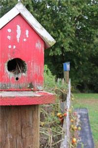 Rustic Handmade Weathered Red Wooden Birdhouse on a Fence Post Journal