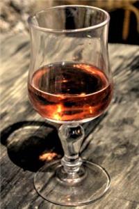 Glass of Cognac on a Rustic Wood Table