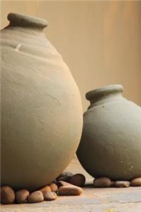 Clay Pots Resting on Rocks