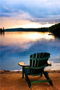 Wooden Chair by the Lake at Sunset