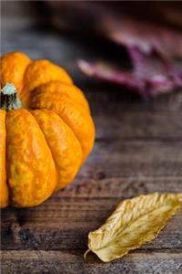 An Orange Pumpkin and Autumn Leaves Harvest Journal