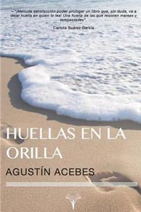 Huellas en la orilla