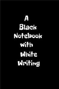 A Black Notebook with White Writing
