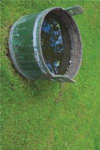 Bucket of Rainwater on the Grass Journal