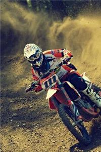 Motocross Rider Making a Turn on the Dirt Track Journal