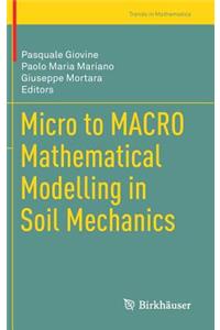 Micro to Macro Mathematical Modelling in Soil Mechanics