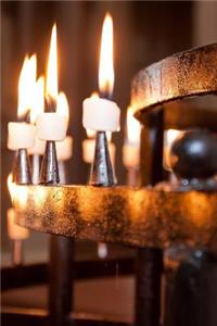 Lighted Candles in a Church Journal