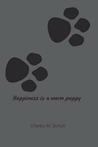Happiness is a warm puppy - Charles M. Schulz