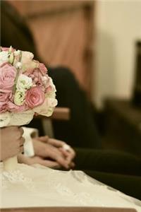 Bride Sitting and Holding the Bridal Bouquet Journal