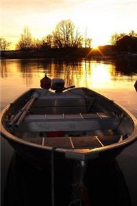 A Sunkissed Boat on a Golden Pond at Sunset Journal