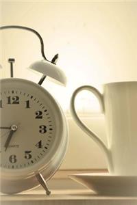 White Alarm Clock and A Cup of Coffee Journal