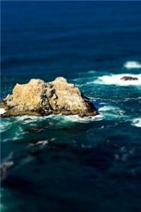 A Craggy Rock Formation in the Blue Ocean at High Tide Beautiful Nature Journal