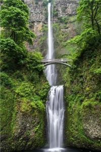 Waterfall behind a Bridge