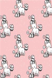Kätzchen mit Pandas Notizbuch