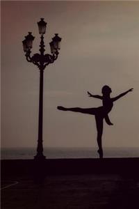 Ballet Dancer in Silhouette on a Pier Near the Ocean Journal