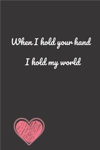 When i hold your hand, I hold my world