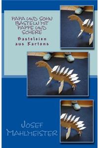 Papa und Sohn basteln mit Pappe und Schere