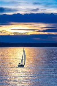 A Sailboat on the Water at Sunset Journal
