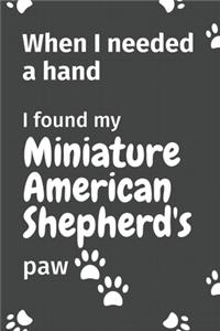 When I needed a hand, I found my Miniature American Shepherd's paw