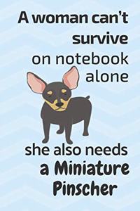 A woman can't survive on notebook alone she also needs a Miniature Pinscher