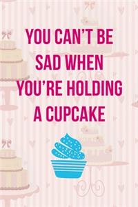 You Can't Be Sad When You Are Holding A Cupcake