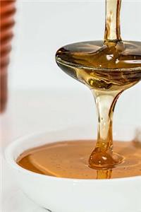 Golden Honey Slowly Dripping from a Spoon Journal