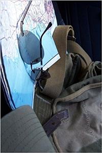 Road Map, Sun Glasses, Hat and Backpack Ready for a Road Trip Journal