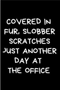 Covered in fur, slobber scratches just another day at the office