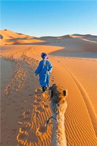 A Berber Walking with a Camel Erg Chebbi Morocco