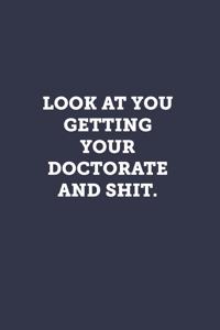 Look at you getting your doctorate and shit.
