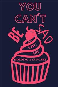 You Can't Be Sad When You Are Holding a Cupcake