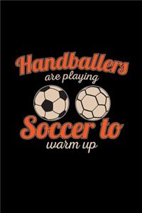 Handballers are playing soccer to warm up