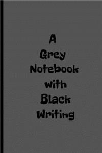 A Grey Notebook with Black Writing