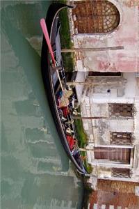 An Empty Gonola Parked in Venice, Italy Journal
