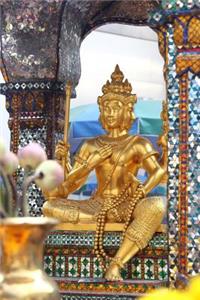 Golden Four-Faced Buddha Statue at Erawan Shrine in Bangkok Thailand
