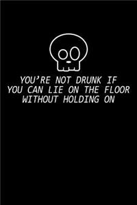 You're not drunk if you can lie on the floor without holding on