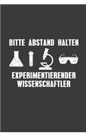 Bitte Abstand halten experimentierender Wissenschaftler