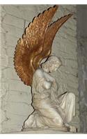 A Lovely Kneeling Angel with Golden Wings Sculpture Journal