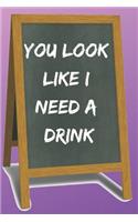 You Look Like I Need a Drink Blank Lined Notebook Journal