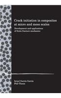 Crack initiation in composites at micro and meso scales