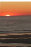 Notebook Sunset Over the Beach and the Ocean