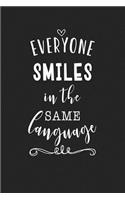 Everyone Smiles in the Same Language: A 6x9 Inch Matte Softcover Journal Notebook with 120 Blank Lined Pages and an Uplifting Cover Slogan