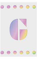 G: Modern minimalist monogram journal in soft pastel gradient colors. Have the initial letter of your name beautifully displayed on a fantasy-inspired 