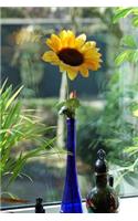 Pretty Yellow Sunflower in a Blue Bottle on a Windowsill Journal: 150 Page Lined Notebook/Diary